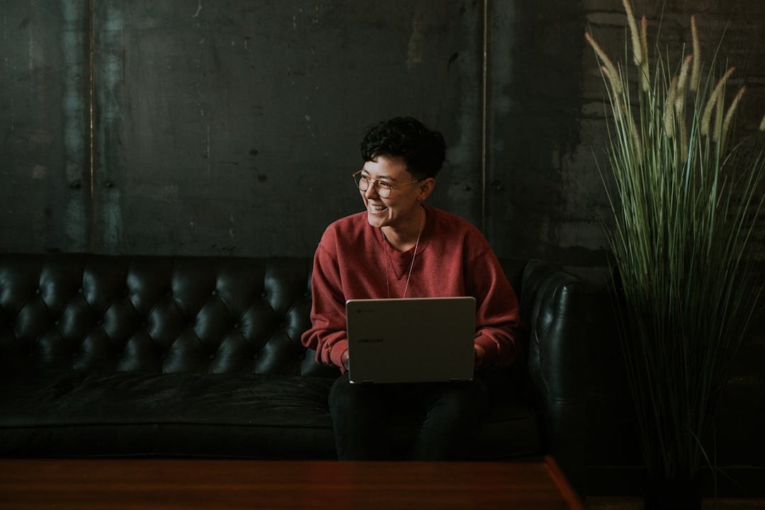 Freelancer researching companies on laptop for cold DM outreach
