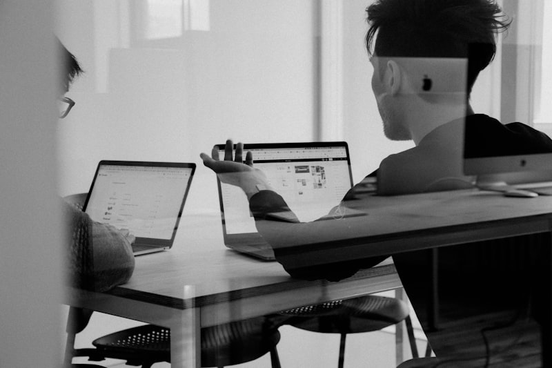 Freelancer researching companies on laptop for cold DM outreach