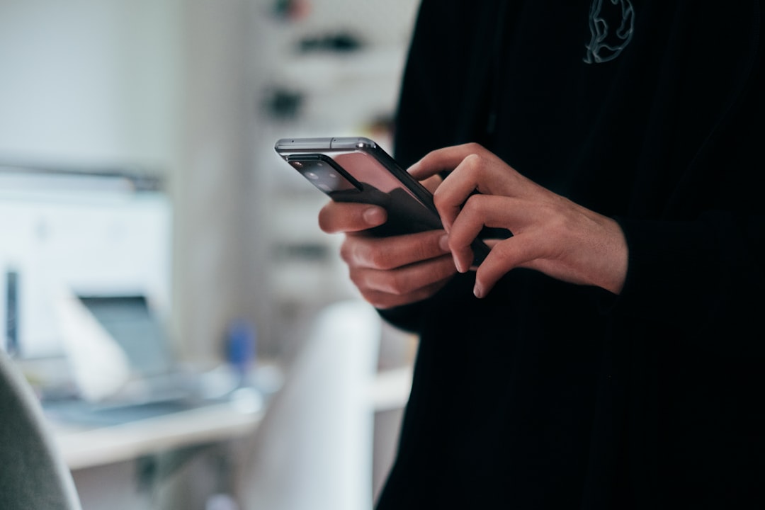 A phone used for chat next to a planning surface — how OpenClaw should reach social