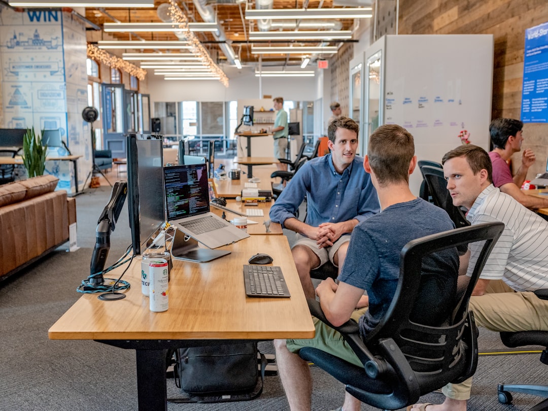 Professional using laptop for LinkedIn content scheduling